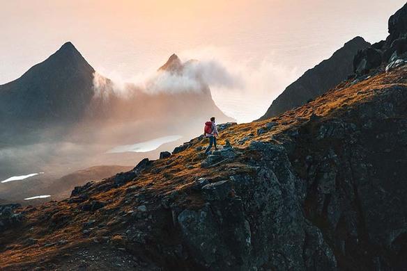 Man Walking Up a Mountain